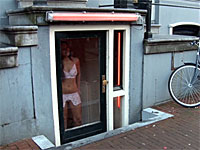 Horny tourist fucks this Amsterdam hooker behind her window